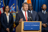 Rep. Latimer speaking behind a podium in Westchester County